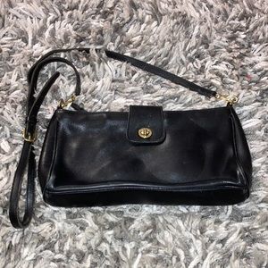 Leather. Coach purse. Black.  Authentic and holds its value.